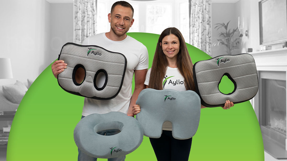 Max Krishtul and Larisa, each holding seat cushions of different shapes.