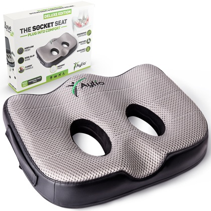 The Aylio Socket Seat cushion at a three-quarter angle, showing its two contoured sit-bone openings and airflow mesh top, beside its retail box.