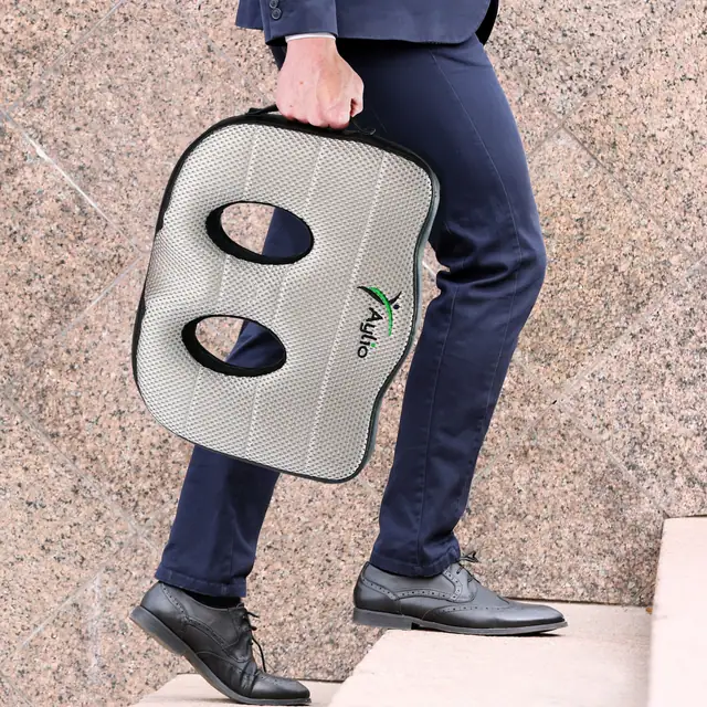 Aylio Socket Seat being carried by the built-in handle
